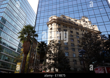 edificio ariztia building reflected in modern bank buildings in the financial district of Santiago Chile Stock Photo
