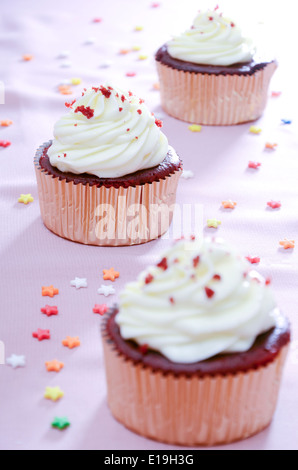 three red velvet cupcakes Stock Photo