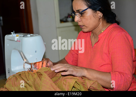 woman stitching Stock Photo