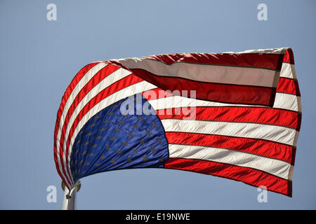 Merrick, New York, USA. 26th May, 2014. The American flag flies, waving in the wind, during the Merrick Memorial Day Parade and Ceremony, hosted by American Legion Post 1282 of Merrick, honoring those who died in war while serving in the United States military. © Ann Parry/ZUMA Wire/ZUMAPRESS.com/Alamy Live News Stock Photo