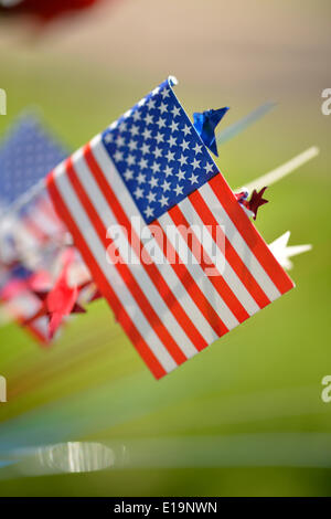 Merrick, New York, USA. 26th May, 2014. American flags and red white and blue decorations, seen close up, decorating a memorial wreath at The Merrick Memorial Day Parade and Ceremony, hosted by American Legion Post 1282 of Merrick, honoring those who died in war while serving in the United States military. © Ann Parry/ZUMA Wire/ZUMAPRESS.com/Alamy Live News Stock Photo