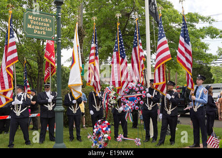 Merrick, New York, USA. 26th May, 2014. Members of the North Merrick Fire Dept. hold flags at The Merrick Memorial Day Parade and Ceremony, hosted by American Legion Post 1282 of Merrick, honoring those who died in war while serving in the United States military. © Ann Parry/ZUMA Wire/ZUMAPRESS.com/Alamy Live News Stock Photo