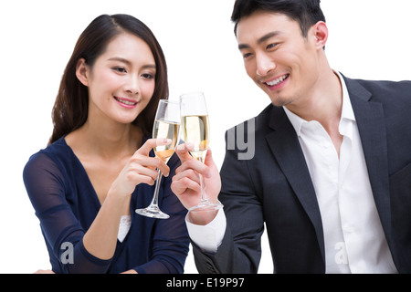 Happy young couple toasting champagne flutes Stock Photo