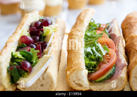 french baguette sandwiches brie and grape ham salad Stock Photo