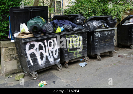 Communal household rubbish bins in the West End of Glasgow, Athole Lane, Scotland, UK Stock Photo