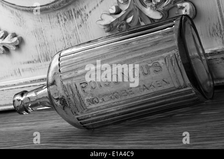 vintage glass bottle with warning, 'poisonous'. Stock Photo