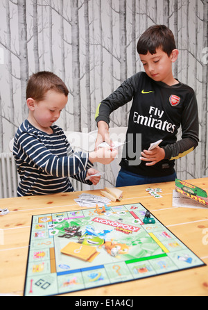 Children playing board games Stock Photo