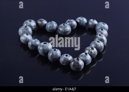 Fresh Blueberries arranged in the shape of a Heart Stock Photo