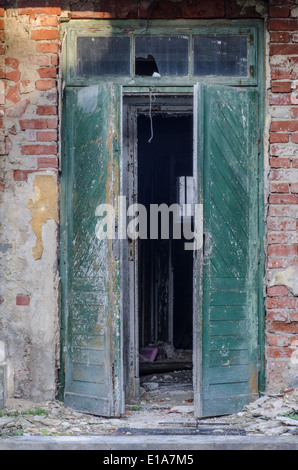 old opened door in abandoned house Stock Photo