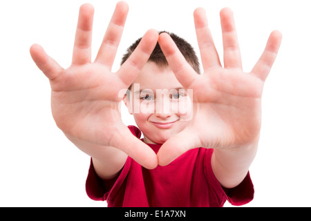 Young boy showing his hands and looking at you between them with confident, all ten fingers are visible Stock Photo