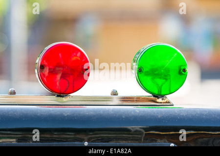 Red And Green Sirens On Car Top Stock Photo