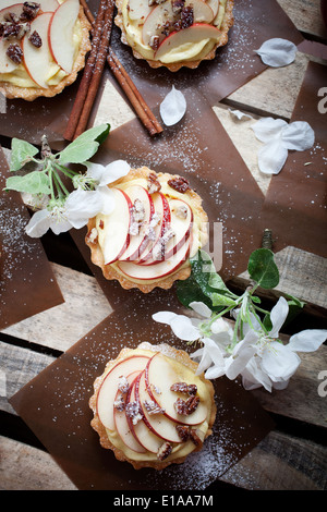 Tartlets with apple slices, cream and pecan filling Stock Photo