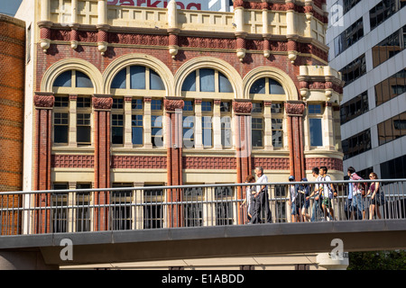 Sydney Australia,elevated walkway,sidewalk,Pyrmont Bridge,Shelbourne,hotel,hotel,hotels,building,man men male,woman female women,walking,Sussex Street Stock Photo