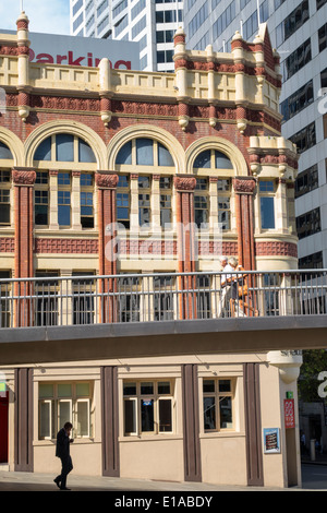 Sydney Australia,elevated walkway,sidewalk,Pyrmont Bridge,Shelbourne,hotel,hotel,hotels,building,man men male,woman female women,walking,Sussex Street Stock Photo