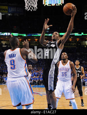 May 25, 2014 - Oklahoma City, OKLAHOMA, USA - San Antonio Spurs' Kawhi Leonard shoots around Oklahoma City Thunder's Serge Ibaka during first half action in Game 3 of the Western Conference Finals Sunday May 25, 2014 at Chesapeake Energy Arena in Oklahoma City, OK. (Credit Image: © San Antonio Express-News/ZUMAPRESS.com) Stock Photo