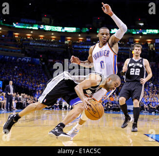 May 25, 2014 - Oklahoma City, OKLAHOMA, USA - San Antonio Spurs' Tony Parker looks for room around Oklahoma City Thunder's Russell Westbrook during second half action in Game 3 of the Western Conference Finals Sunday May 25, 2014 at Chesapeake Energy Arena in Oklahoma City, OK. The Thunder won 106-97. (Credit Image: © San Antonio Express-News/ZUMAPRESS.com) Stock Photo