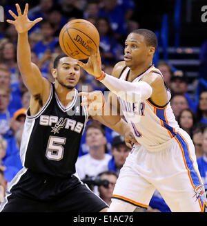 May 27, 2014 - Oklahoma City, OKLAHOMA, USA - Oklahoma City Thunder's Russell Westbrook passes around San Antonio Spurs' Cory Joseph during second half action in Game 4 of the Western Conference Finals Tuesday May 27, 2014 at Chesapeake Energy Arena in Oklahoma City, OK. (Credit Image: © San Antonio Express-News/ZUMAPRESS.com) Stock Photo