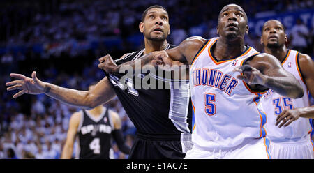 May 27, 2014 - Oklahoma City, OKLAHOMA, USA - San Antonio Spurs' Tim Duncan and Oklahoma City Thunder's Kendrick Perkins struggle for position during second half action in Game 4 of the Western Conference Finals Tuesday May 27, 2014 at Chesapeake Energy Arena in Oklahoma City, OK. (Credit Image: © San Antonio Express-News/ZUMAPRESS.com) Stock Photo