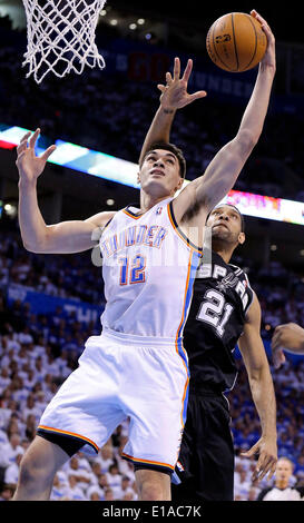 May 27, 2014 - Oklahoma City, OKLAHOMA, USA - Oklahoma City Thunder's Steven Adams and San Antonio Spurs' Tim Duncan grab for a rebound during first half action in Game 4 of the Western Conference Finals Tuesday May 27, 2014 at Chesapeake Energy Arena in Oklahoma City, OK. (Credit Image: © San Antonio Express-News/ZUMAPRESS.com) Stock Photo