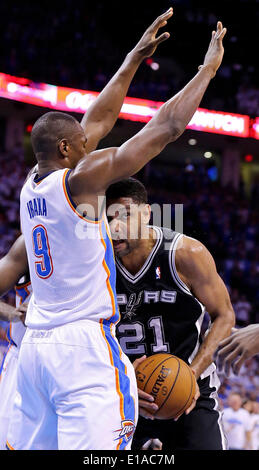 May 27, 2014 - Oklahoma City, OKLAHOMA, USA - Oklahoma City Thunder's Serge Ibaka defends San Antonio Spurs' Tim Duncan during first half action in Game 4 of the Western Conference Finals Tuesday May 27, 2014 at Chesapeake Energy Arena in Oklahoma City, OK. (Credit Image: © San Antonio Express-News/ZUMAPRESS.com) Stock Photo
