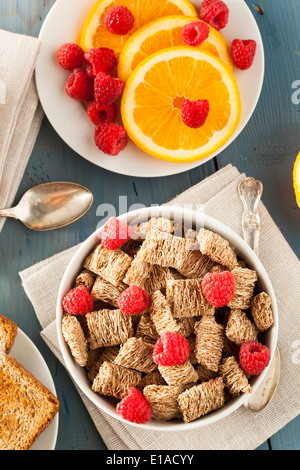 Healthy Whole Wheat Shredded Cereal with Fruit for Breakfast Stock Photo