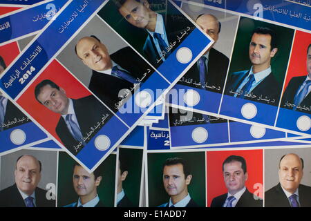 Tehran, Iran. 28th May, 2014. Ballots with portraits of the 2014 Syria's Presidential election candidates HASSAN ABDULLAH NURI, BASHAR AL-ASSAD and MAHER ABDUL HAFIZ HAJJAR, are pictured on a desk at a pooling station in the Syrian Embassy in northern Tehran during the 2014 Syria's Presidential election. © Morteza Nikoubazl/ZUMA Wire/ZUMAPRESS.com/Alamy Live News Stock Photo