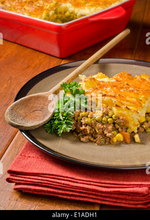A hot and hearty shepherd's pie with cheddar cheese. Stock Photo