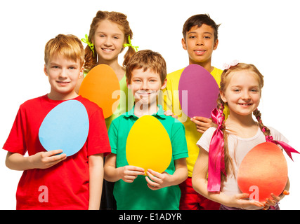 Cheerful kids holding egg shape colourful cards