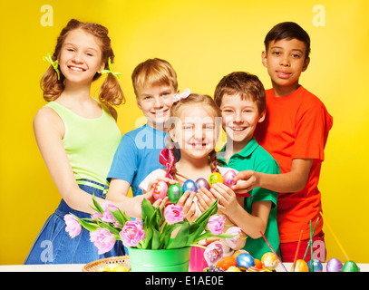 Children portrait who hold Eastern eggs and smile Stock Photo