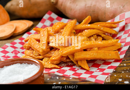 A serving of delicious deep fried sweet potato fries. Stock Photo