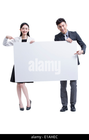 Businessman and businesswoman presenting a whiteboard Stock Photo