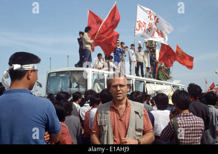 (FILE) - An archive picture, dated 19 May 1989, shows dpa correspondent Edgar Bauer standing amongst a crowd of protesting students on Tiananmen Square in Bejing, China. 25 Years ago, the protests widened in Chinas captial but were eventually violently beaten down. Photo: Edgar Bauer/dpa Stock Photo