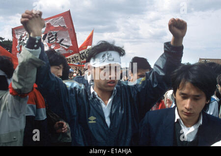 (FILE) - An archive picture, dated 13 May 1989, shows leader of the student protests Wuer Kaixi protesting amongst a crowd of students during a demonstration on Tiananmen Square in Bejing, China. Kaixi wears a headband which reads 'Jueshi' (hunger strike). 25 Years ago, the protests widened in China's captial but were eventually beaten down violently. Photo: Edgar Bauer/dpa Stock Photo