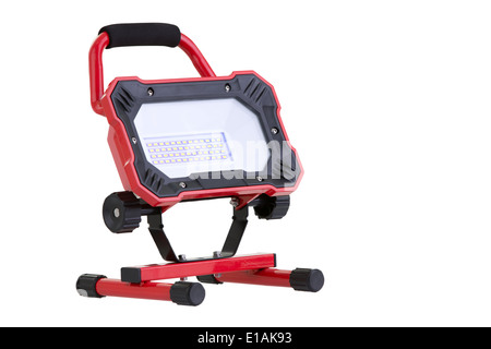 Red portable battery operated metal LED work light isolated on white Stock Photo