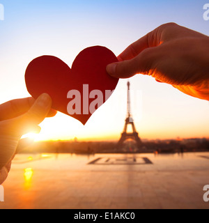 heart in hands, loving couple in Paris, France Stock Photo