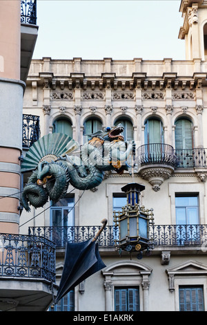 Chinese Dragon Sculpture on the Walls of a House Decorated with Umbrellas,  Bruno Quadras Building, Las Ramblas, Barcelona Stock Photo