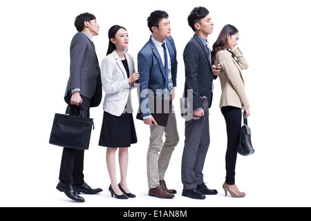 Young commuters waiting in line Stock Photo