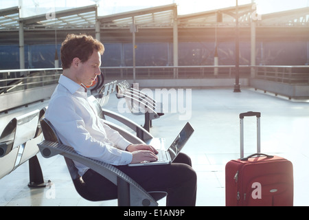 using internet in the airport terminal Stock Photo