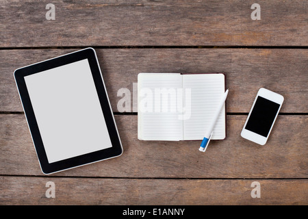 tablet and smartphone on wooden desk Stock Photo