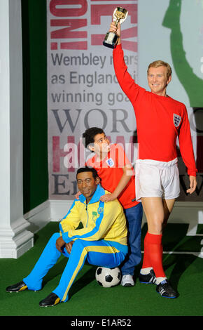 London, UK. 28th May, 2014. The final touches are put to Pele and Bobby Moore's wax figures by studio artist Caryn Bloom, as two sporting legends are brought together at Madame Tussauds London in time for the 2014 Fifa World Cup™ next month. Credit:  Madame Tussauds/brian jordan/Alamy Live News Stock Photo