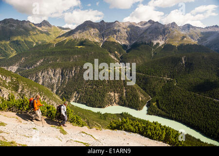 Hikers descending from Mt Murter into the Spöl Valley, Val dal Spöl, Swiss National Park, Graubünden, Switzerland Stock Photo