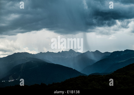rain clouds over mountains Stock Photo