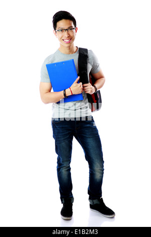 Full length portrait of a student with backpack and notebook standing over white background Stock Photo