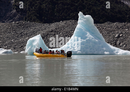 Boat tour on Tasman Lake with icebergs Stock Photo