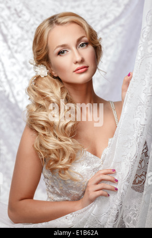 Portrait of a beautiful bride in a white dress. Stock Photo