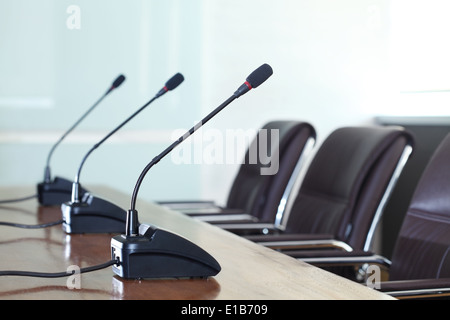 Conference microphones in a meeting room Stock Photo