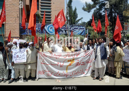 Activists of Public Works Department (PWD) Employees Union (CBA) chant slogans against price hiking and demanding to increase their salaries during protest demonstration at Quetta press club on Thursday, May 29, 2014. Stock Photo