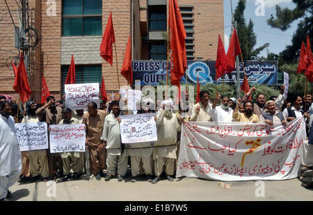 Activists of Public Works Department (PWD) Employees Union (CBA) chant slogans against price hiking and demanding to increase their salaries during protest demonstration at Quetta press club on Thursday, May 29, 2014. Stock Photo