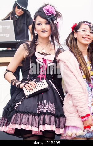 Gothic Lolita dressed in black and pink Stock Photo