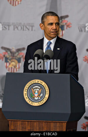 US President Barack Obama gives the commencement address at the graduation ceremony at the U.S. Military Academy May 28, 2014 in West Point, New York. Stock Photo